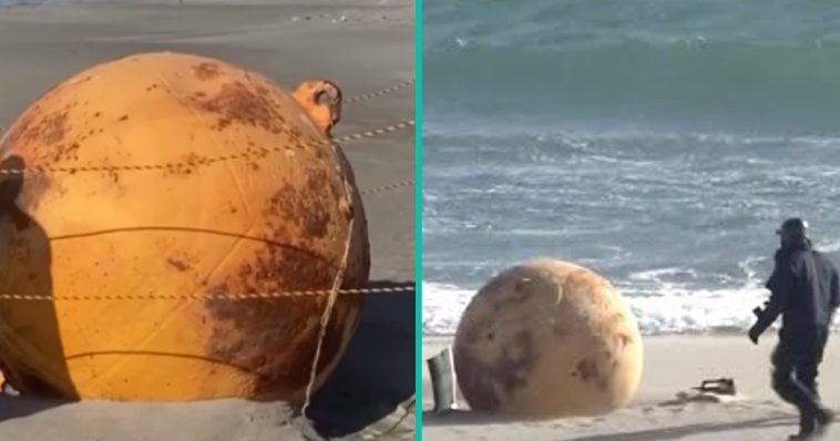 Japan verbijsterd door gigantische metalen bal die op strand aanspoelde
